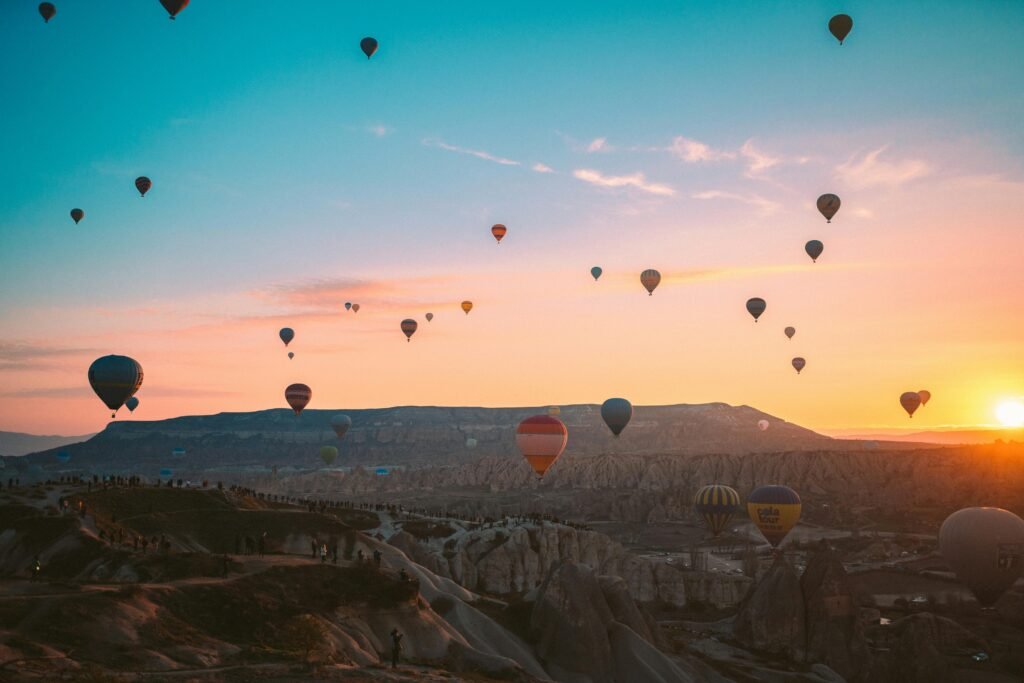 pexels-photo-3889704-3889704 Colorful hot air balloons soaring over Cappadocia at sunrise, Turkey.